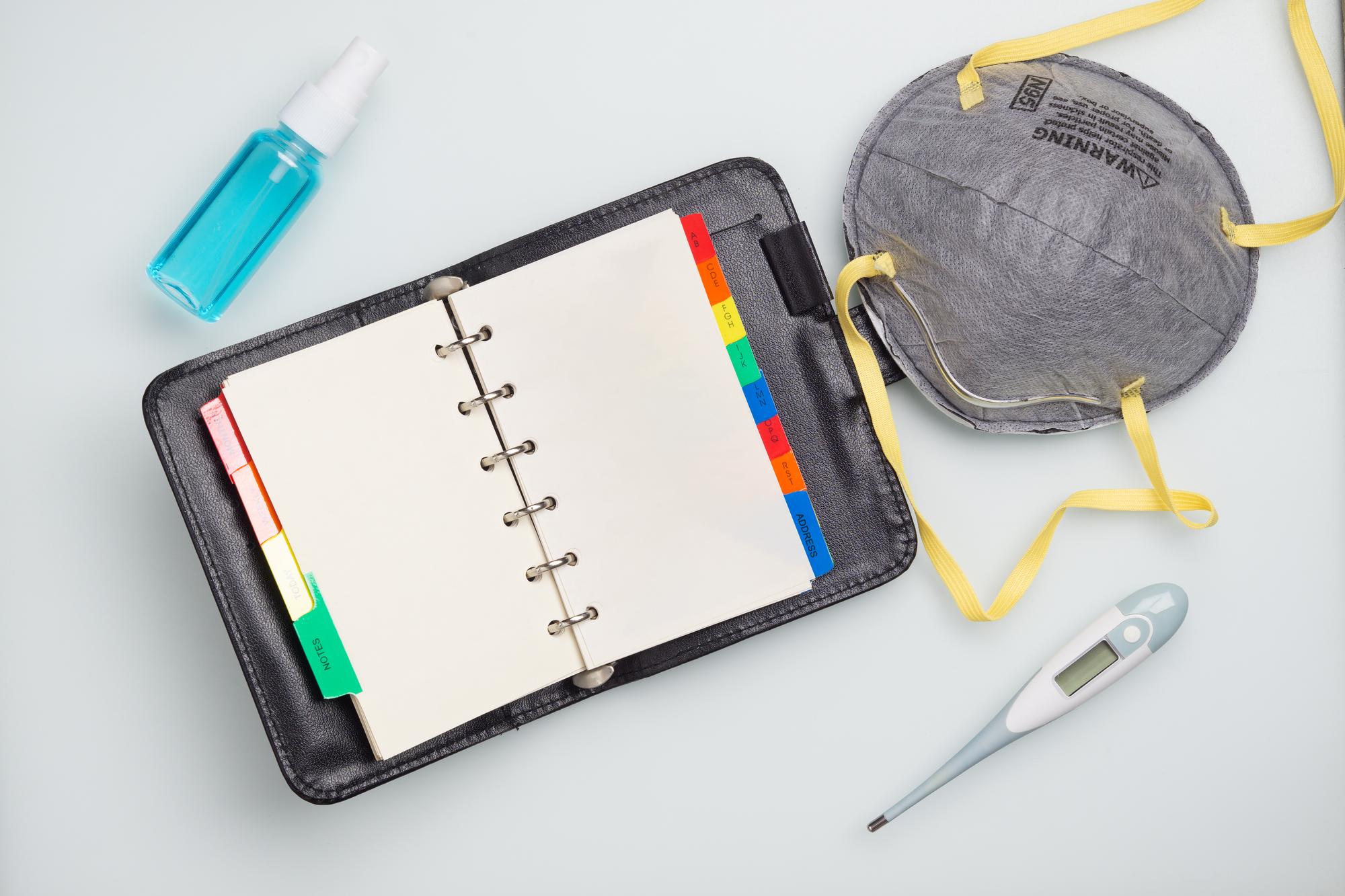 Studio workspace with hoops, threads and digital planner