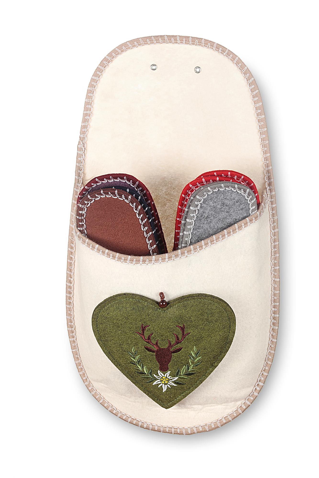 Set of embroidered badges laid out on white surface