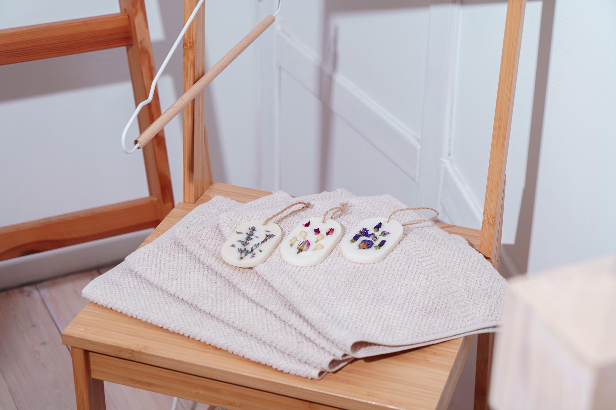 Three sample embroidered patches on craft table